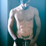 topless man with white mask